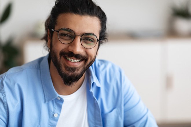 Man smiling with braces