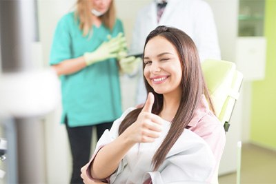 Patient in Plain City giving a thumbs-up after a filling