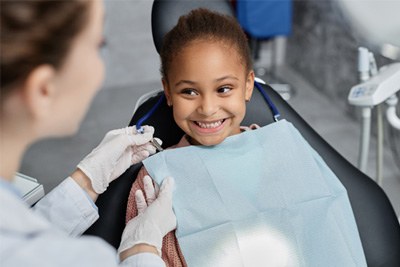 Girl smiling at the dentist