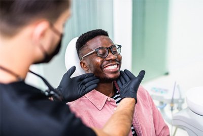 Man smiling at the dentist