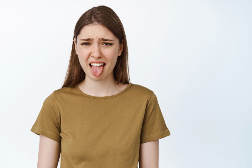 A woman with a bad taste in her mouth