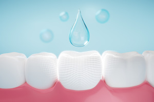 Illustration of a drop of fluoride falling on a tooth